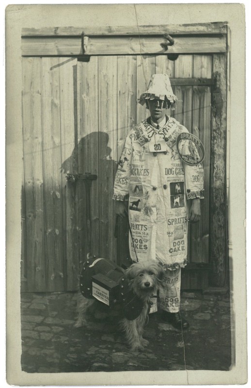 Portrait of a young man in fancy dress advertising Spratts dog cakes, circa 1900s