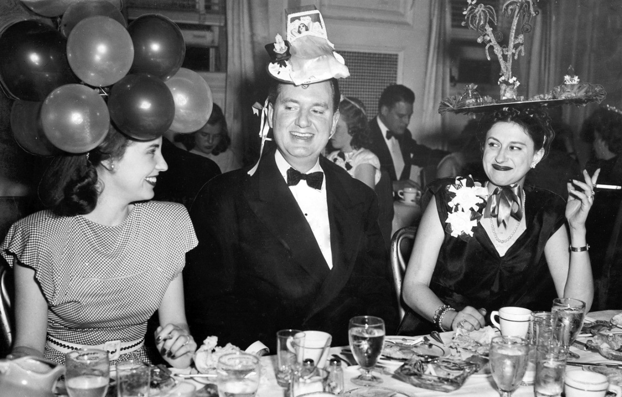The Mad Hatters' Ball, a Junior League dinner-dance. Left to right: Mrs. William Sample, City Commissioner Arthur Weaver and Mrs. Weaver. S.J. MELINGAGIO/THE WORLD-HERALD ran May 4, 1947