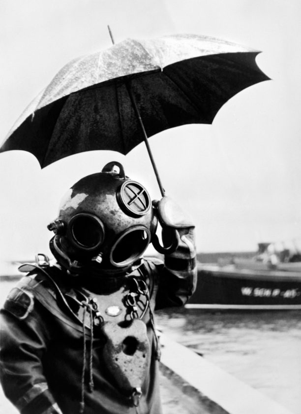 Picture dated 1949 of scuba diver with an umbrella. In 1943, Captain Jacques-Yves Cousteau invents, with Emile Gagnan, the first commercially successful open circuit type of Scuba diving equipment, the aqualung.