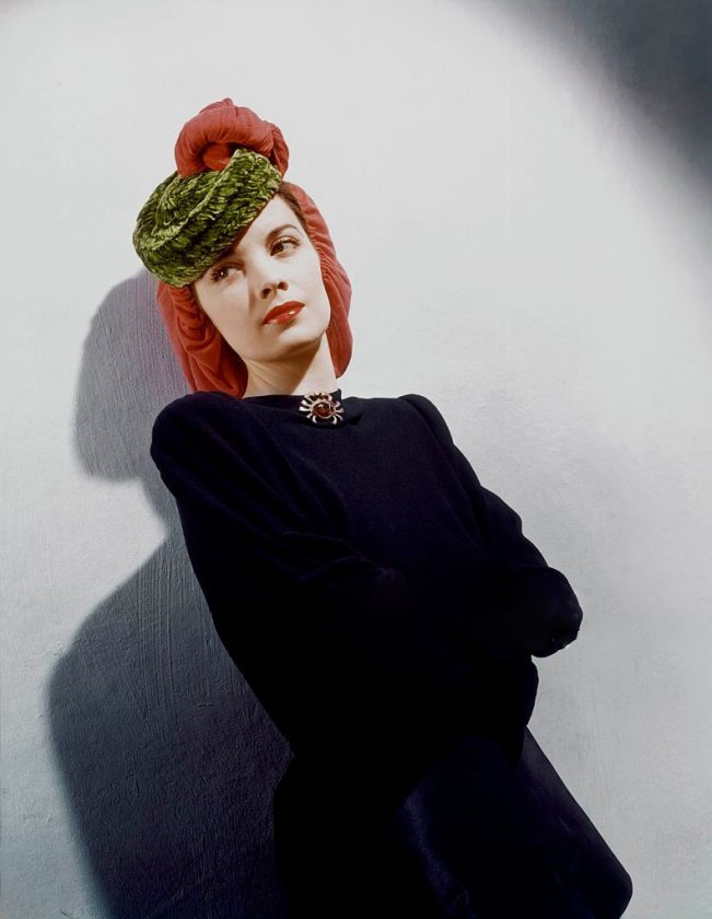 Model in wool jersey snood with chenille pill-box *** Local Caption ***